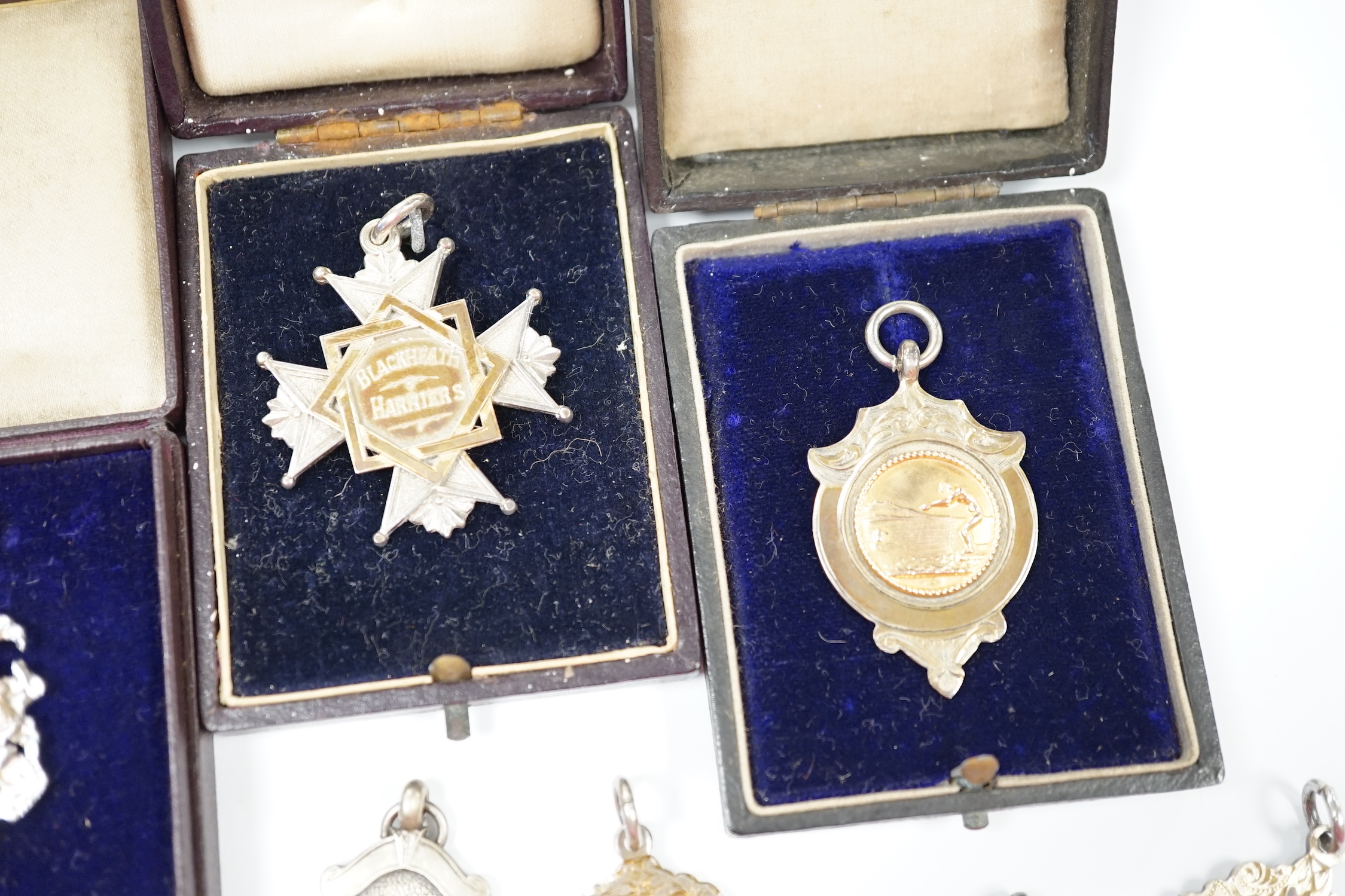 An Edwardian 9ct gold medallion, Birmingham, 1905, 36mm, 4.1 grams, together with thirteen other sporting related medallions including eleven silver, two with enamel.